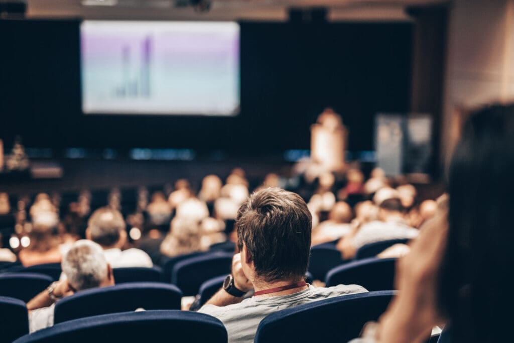 Speaker giving a talk at a scientific conference – Seminars