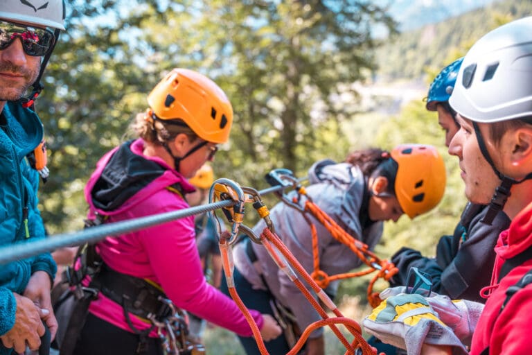 Diverse Group Preparing for Zipline Adventure — Accrobranche